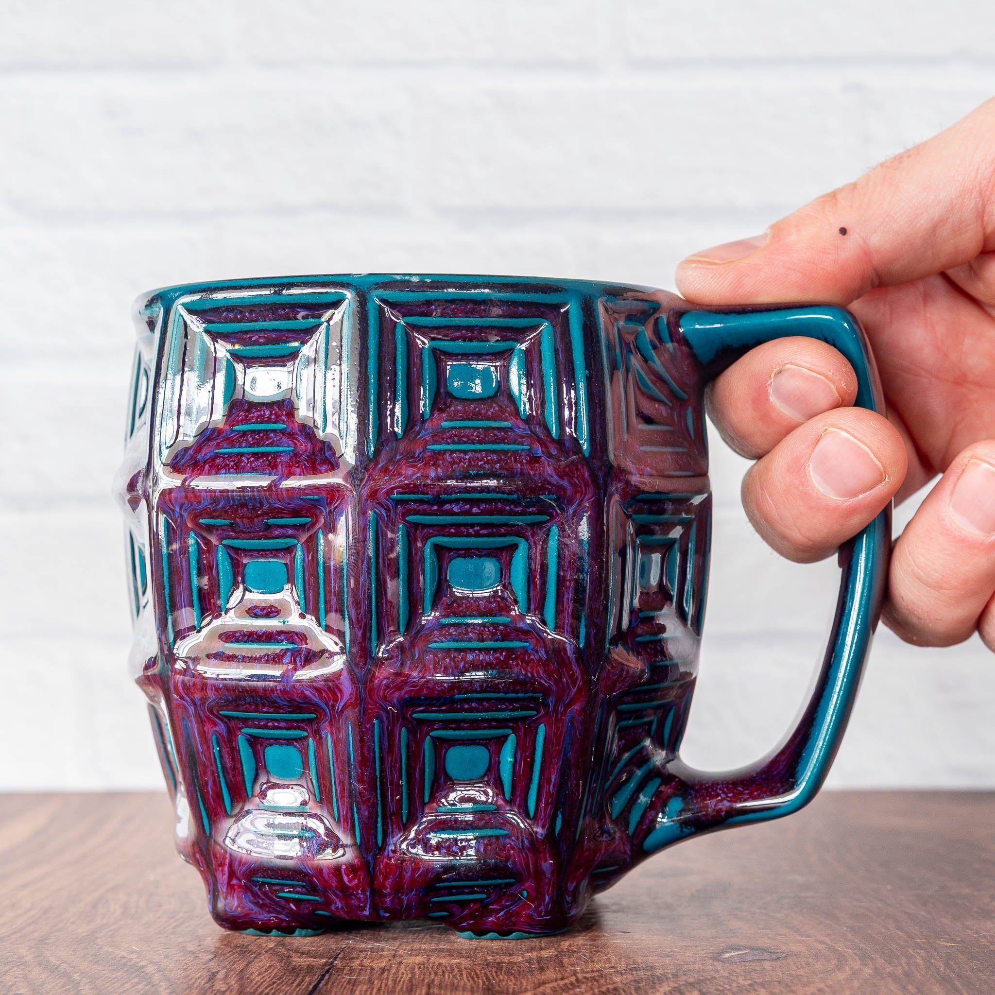 Hammerly Ceramics handmade slip-cast mug in glossy deep crimson and teal, barrel-shaped with concentric recessed squares