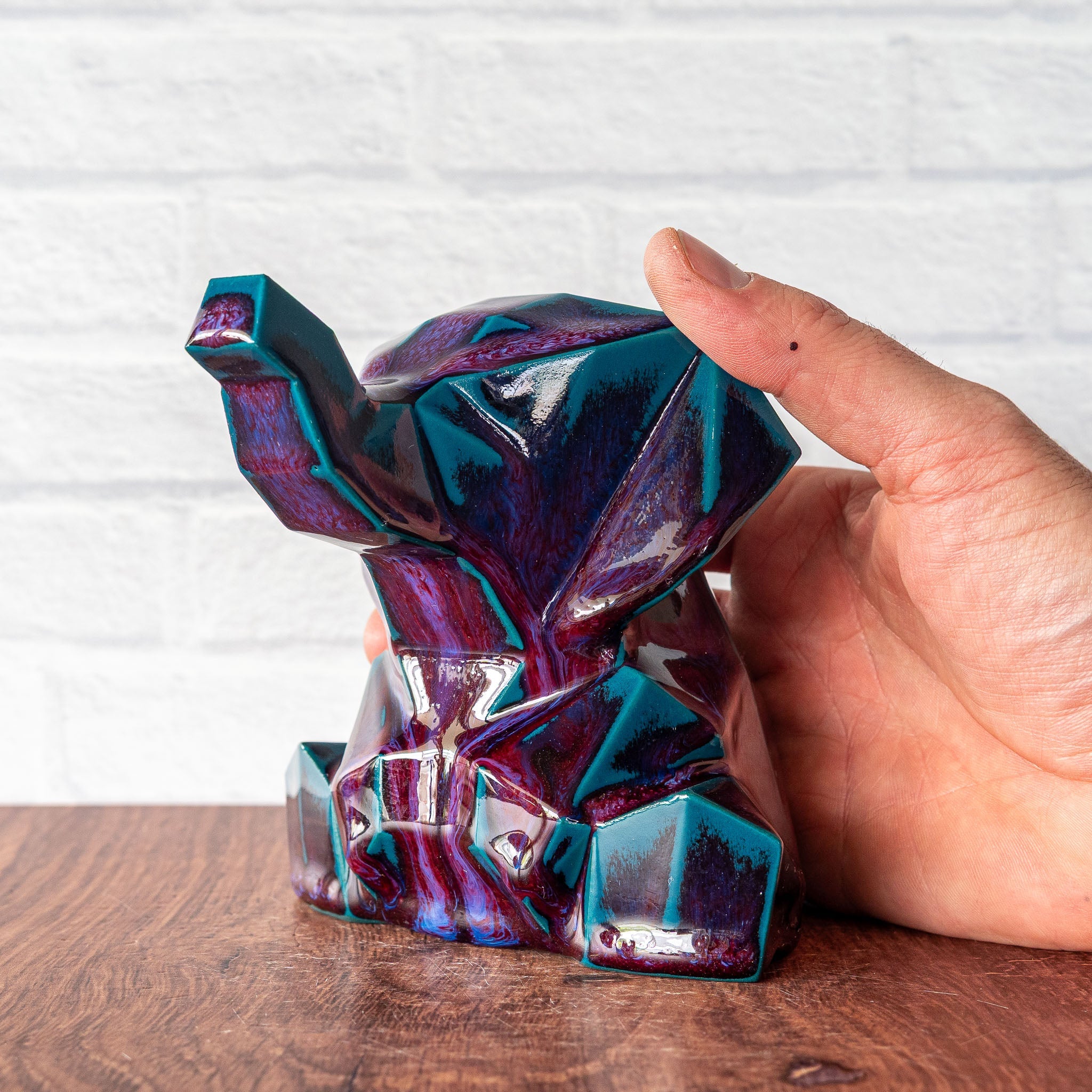 Hammerly Ceramics handmade decorative elephant statue in glossy deep crimson and teal, geometric elephant form