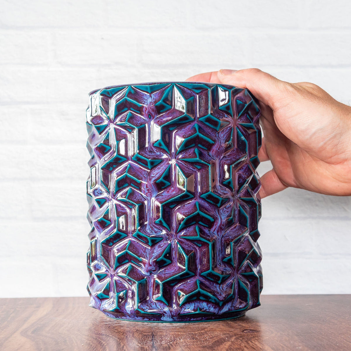 Hammerly Ceramics handmade slip-cast vase in glossy deep crimson and teal , interlocking geometric weave textured porcelain