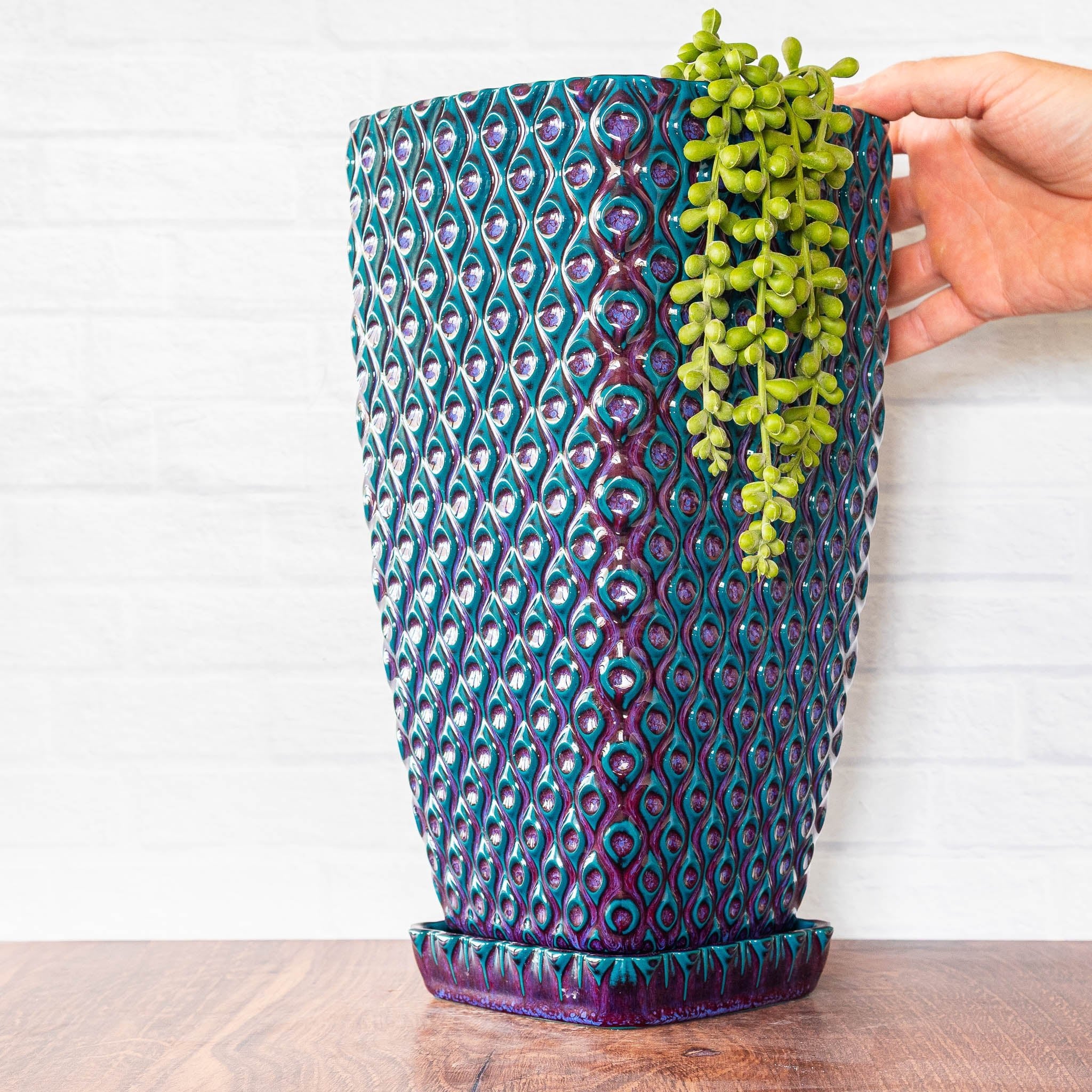 Hammerly Ceramics handmade slip-cast planter in glossy deep crimson and teal, interlocking oval textured porcelain with drip tray