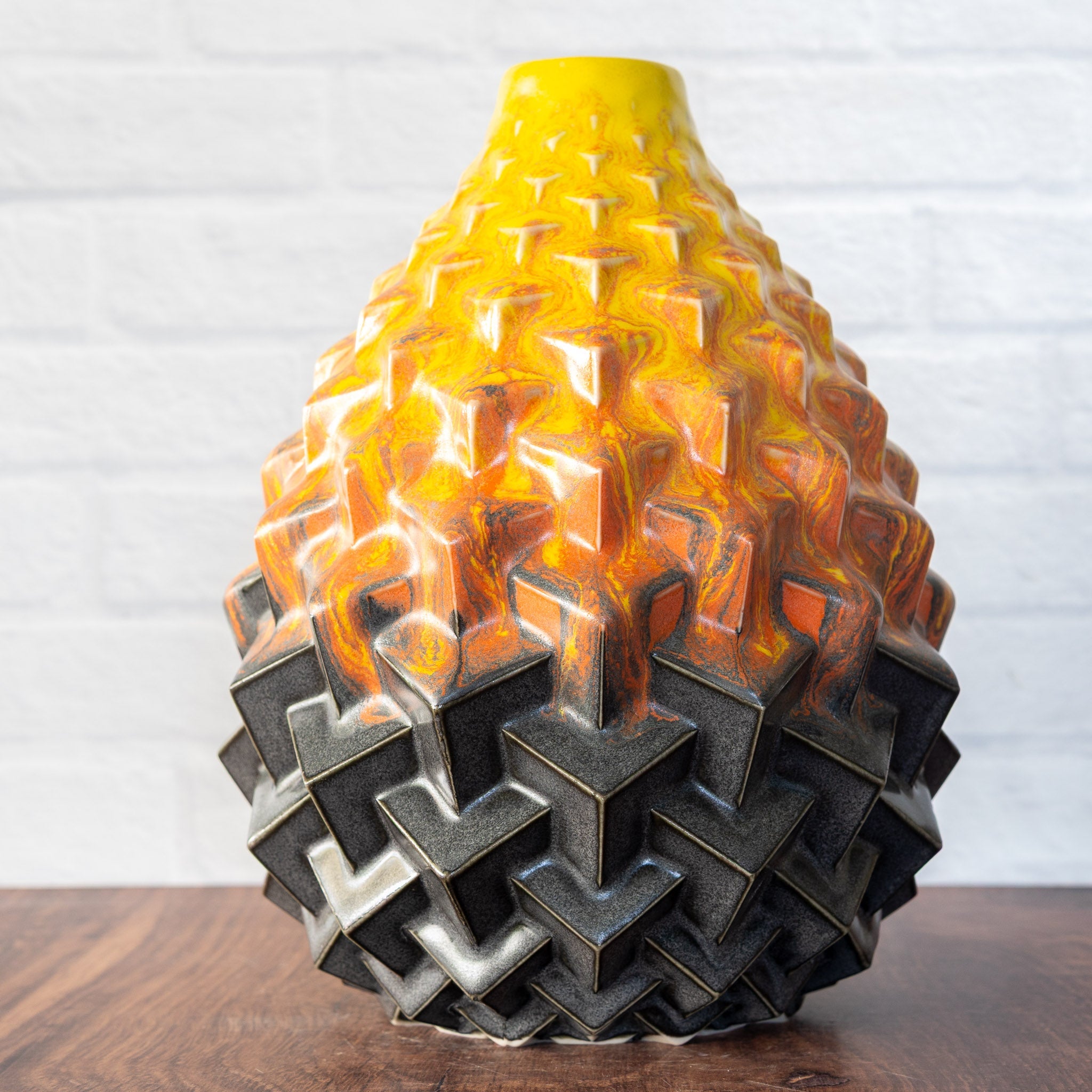 Hammerly Ceramics handmade slip-cast Stacked Cubes Vase in cascading orange and yellow over matte black, geometric textured porcelain