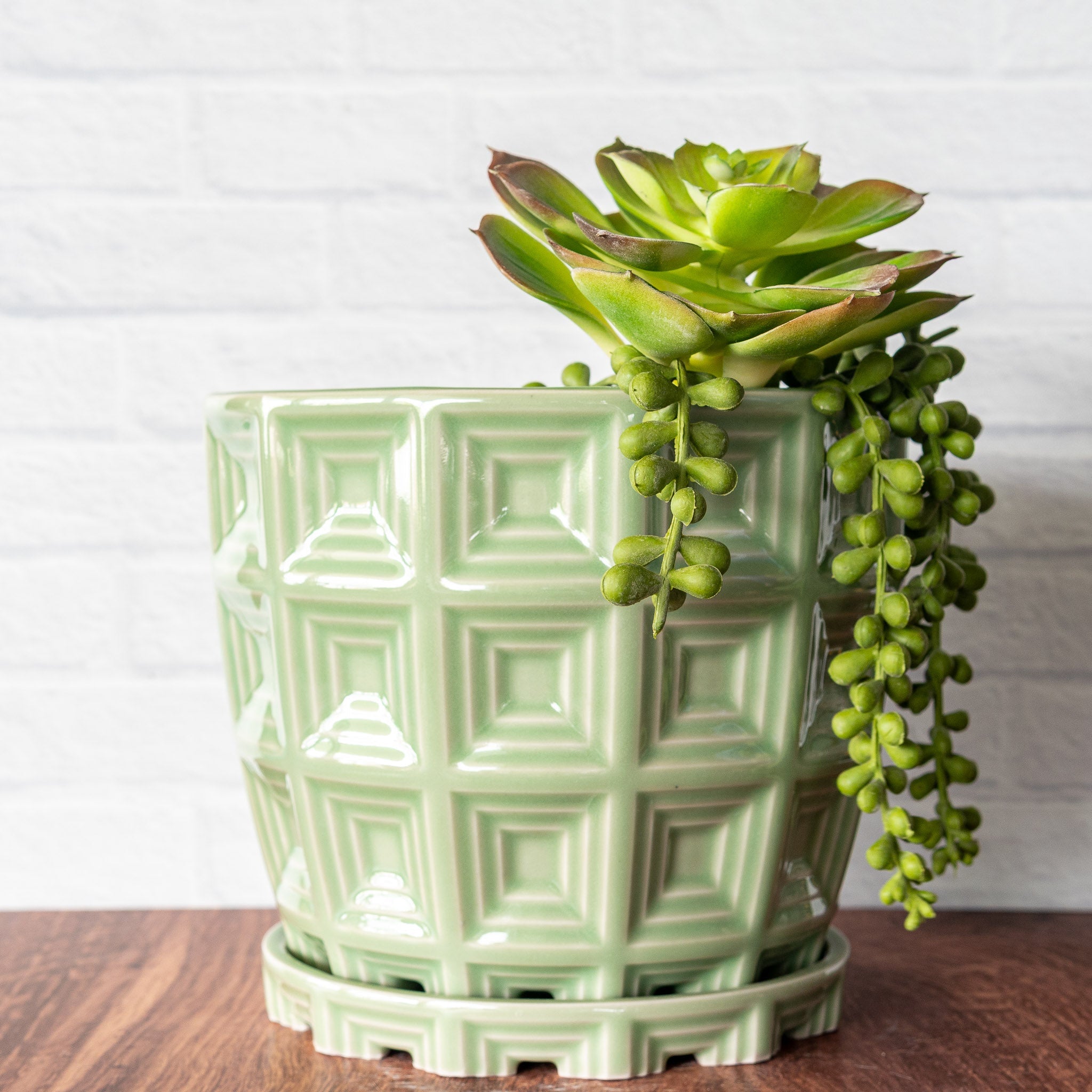 Hammerly Ceramics handmade slip-cast planter in glossy, translucent green celadon glaze, barrel-shaped with concentric recessed squares