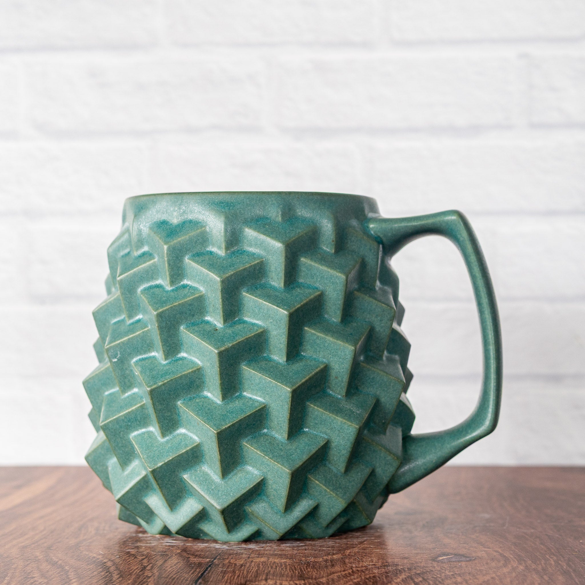 Hammerly Ceramics handmade slip-cast mug in smooth, matte jade green, geometric cubes textured porcelain