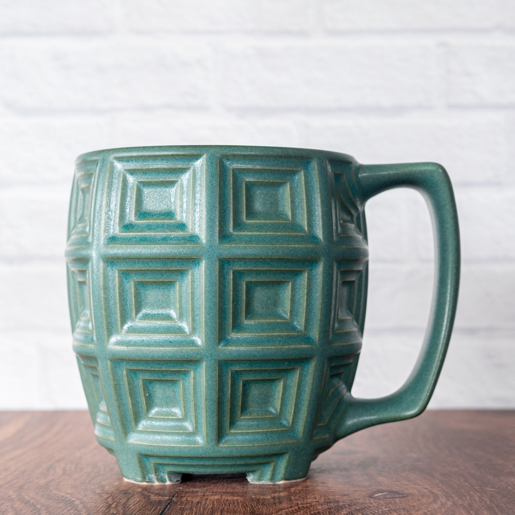 Hammerly Ceramics handmade slip-cast mug in smooth, matte jade green, barrel-shaped with concentric recessed squares