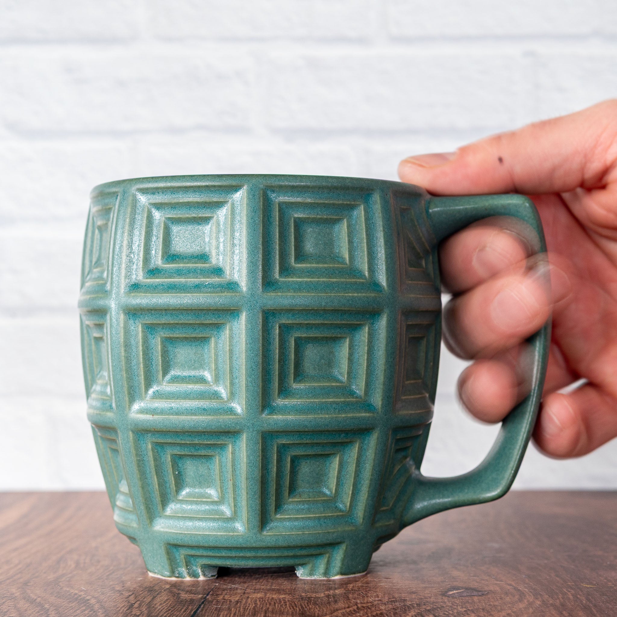 Hammerly Ceramics handmade slip-cast mug in smooth, matte jade green, barrel-shaped with concentric recessed squares