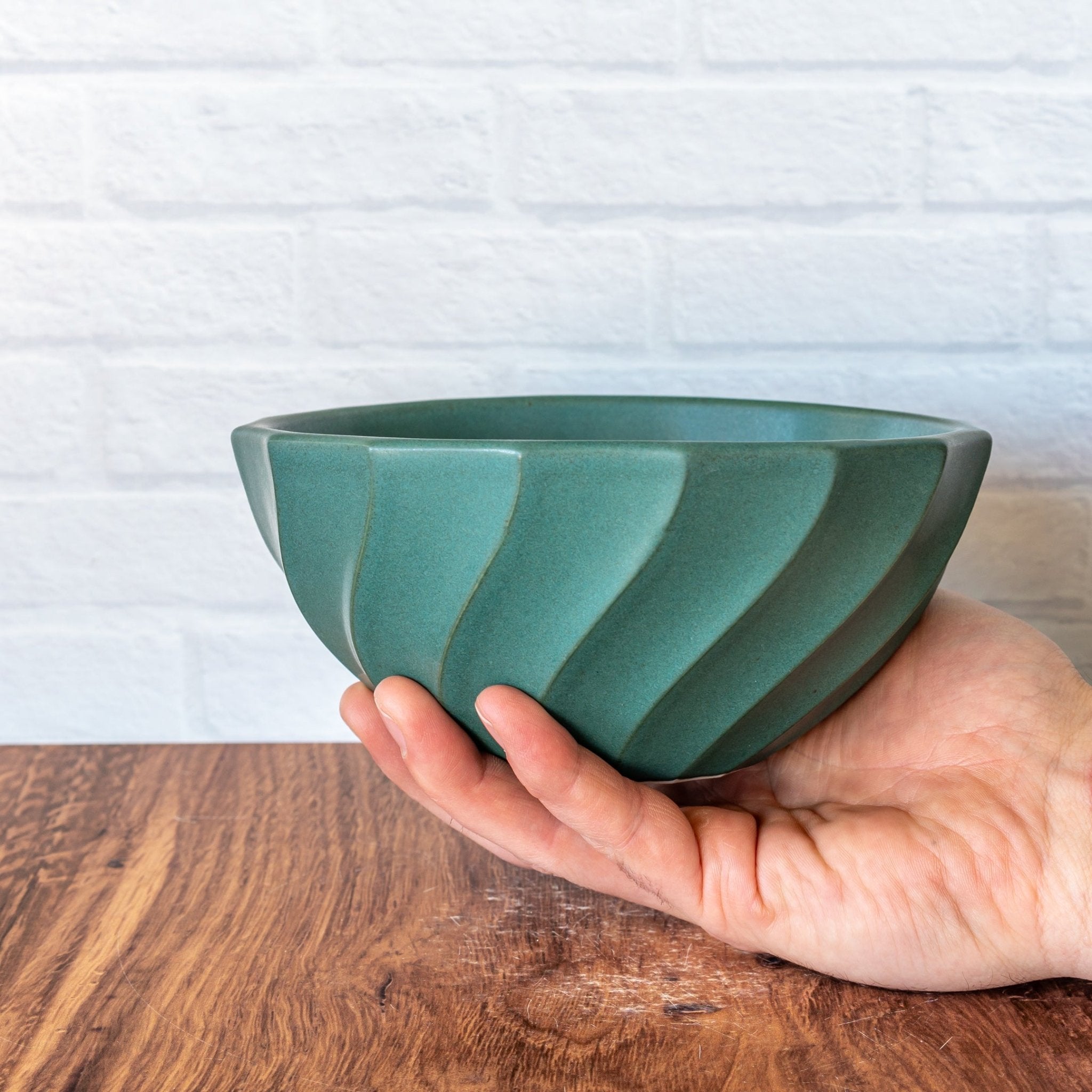Hammerly Ceramics handmade slip-cast bowl in smooth, matte jade green, geometric twist texture