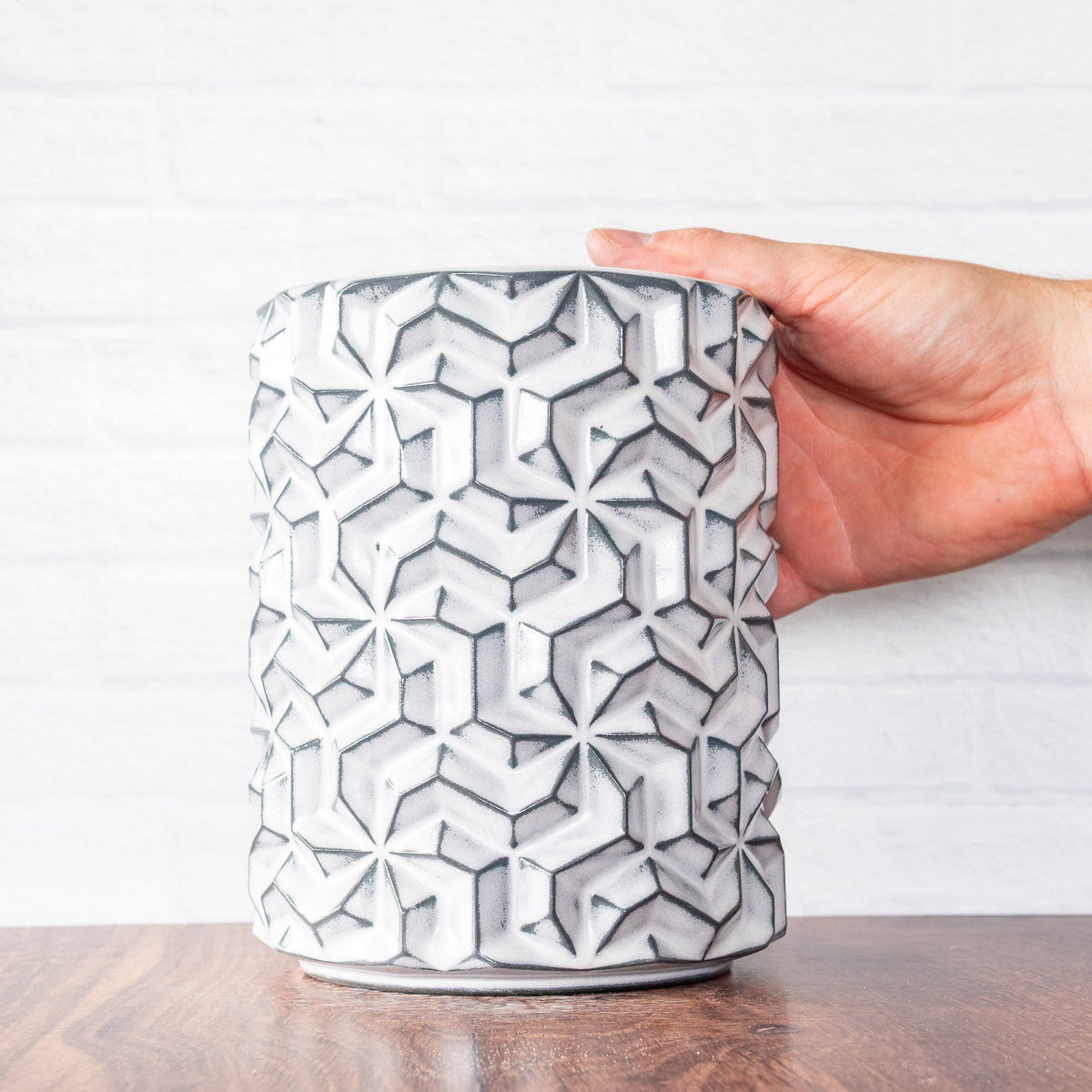 Hammerly Ceramics handmade slip-cast vase in bright white over charcoal edges , interlocking geometric weave textured porcelain