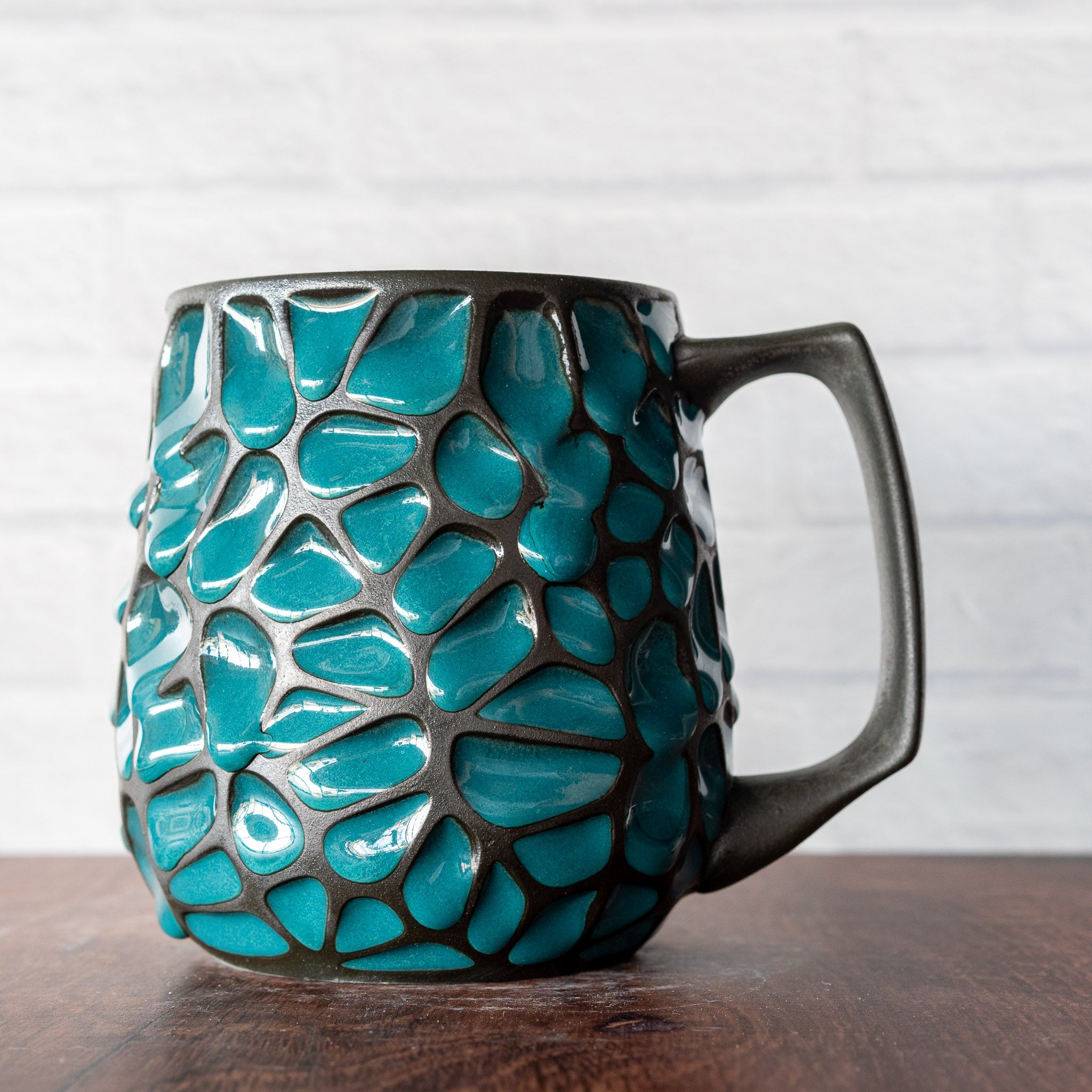 Hammerly Ceramics handmade slip-cast mug in jade green pools with matte black borders, geometric organic cell-like textured porcelain