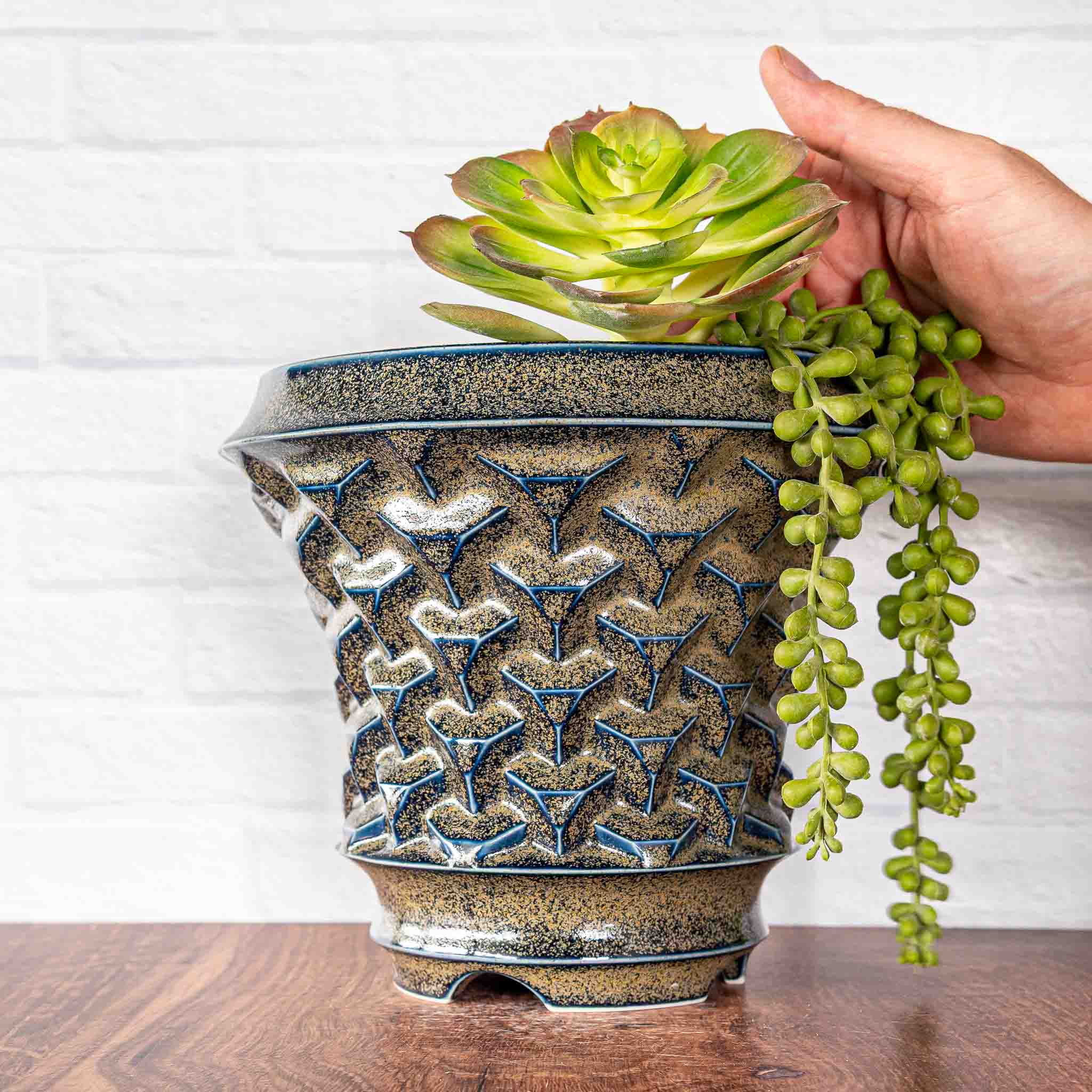 Hammerly Ceramics handmade slip-cast planter in glossy deep navy glaze with gold speckles, geometric repeating truncated cubes texture