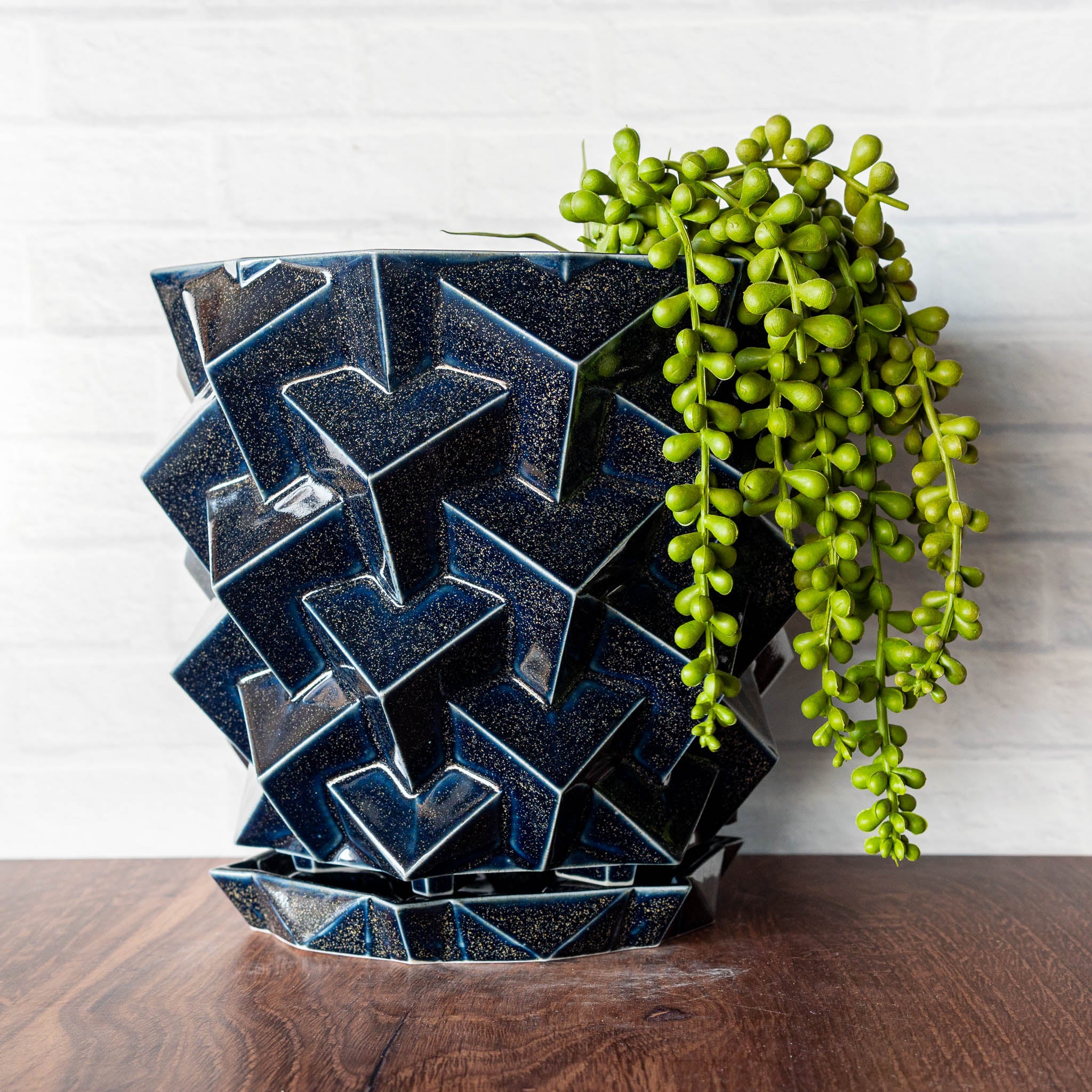 Hammerly Ceramics handmade slip-cast planter in glossy deep navy glaze with gold speckles, geometric cubes textured porcelain