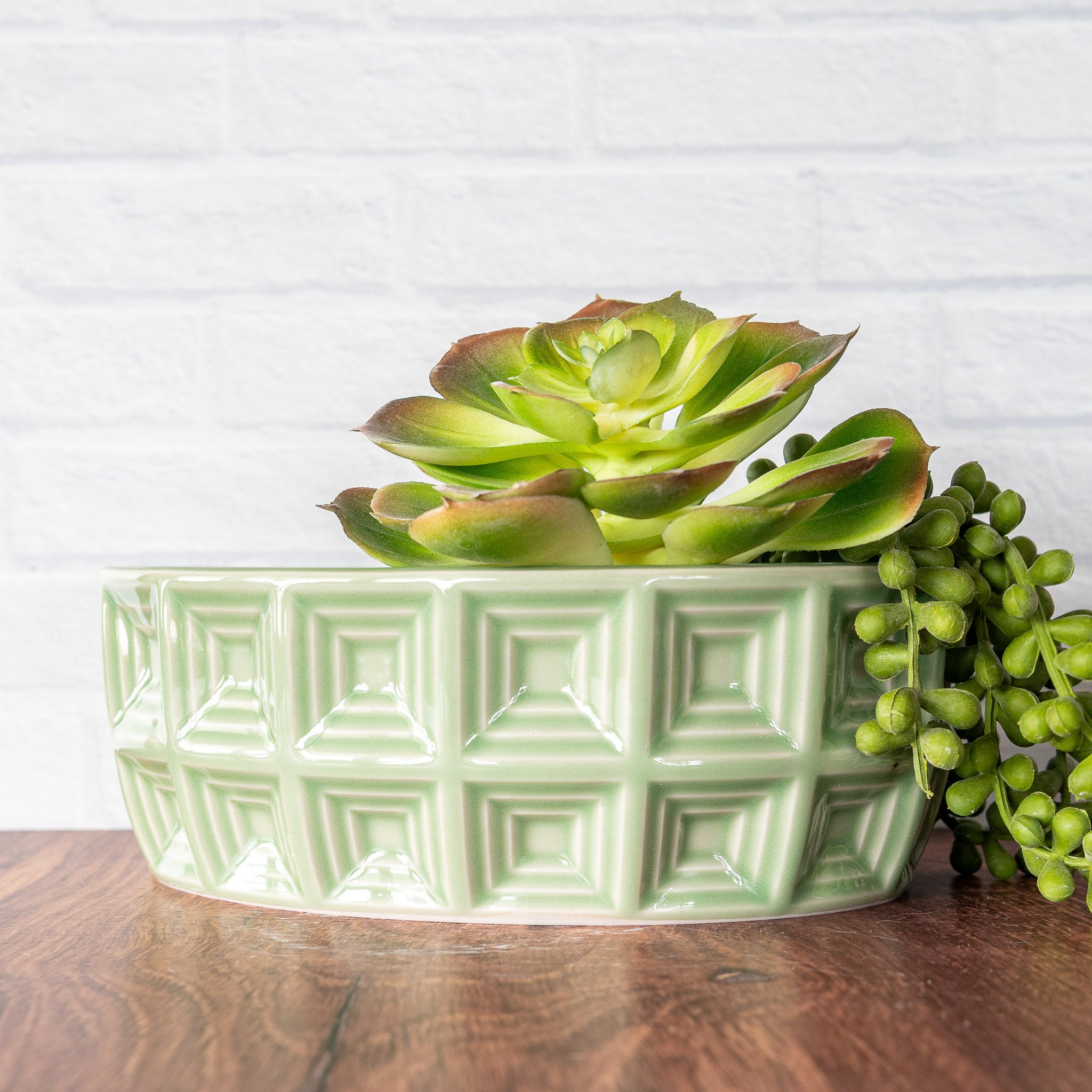 Hammerly Ceramics handmade slip-cast planter in glossy, translucent green celadon glaze, oval with concentric recessed squares 