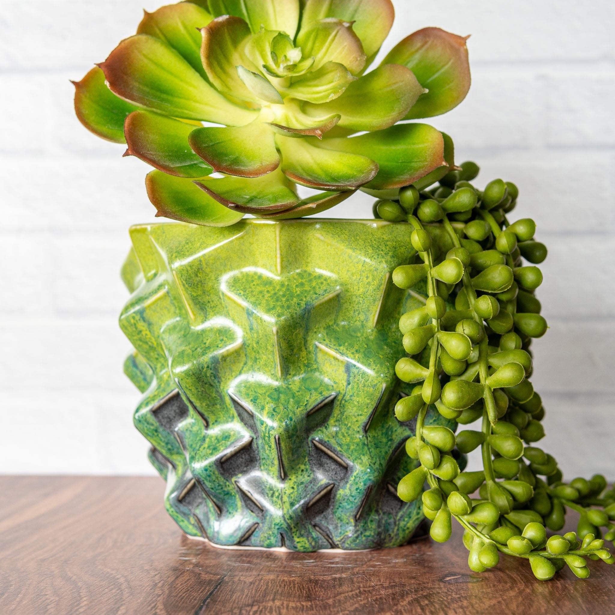 Hammerly Ceramics handmade slip-cast planter in light green and teal flowing over charcol black, geometric cubes textured porcelain
