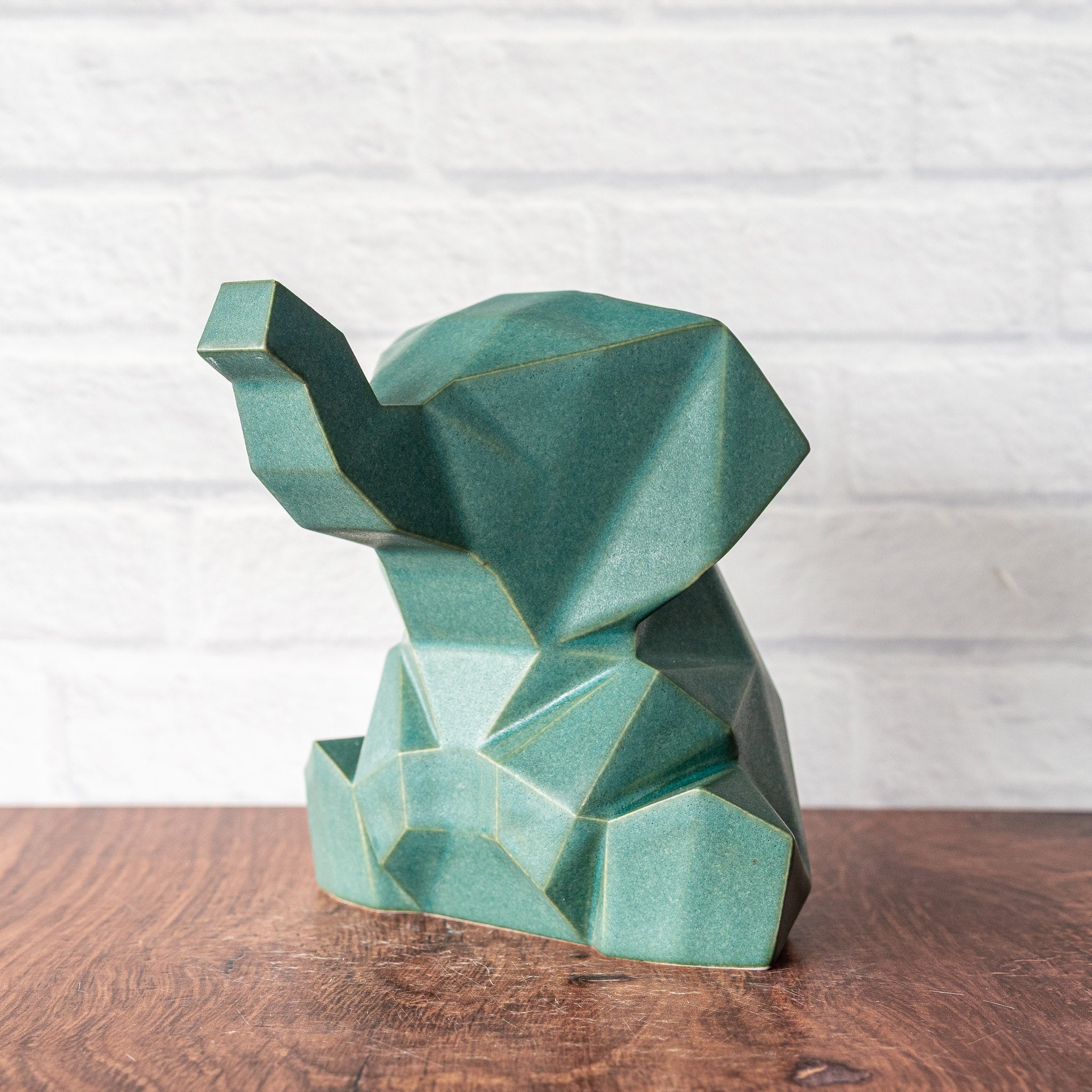 Hammerly Ceramics handmade slip-cast statue in smooth, matte jade green, low polygon geometric porcelain