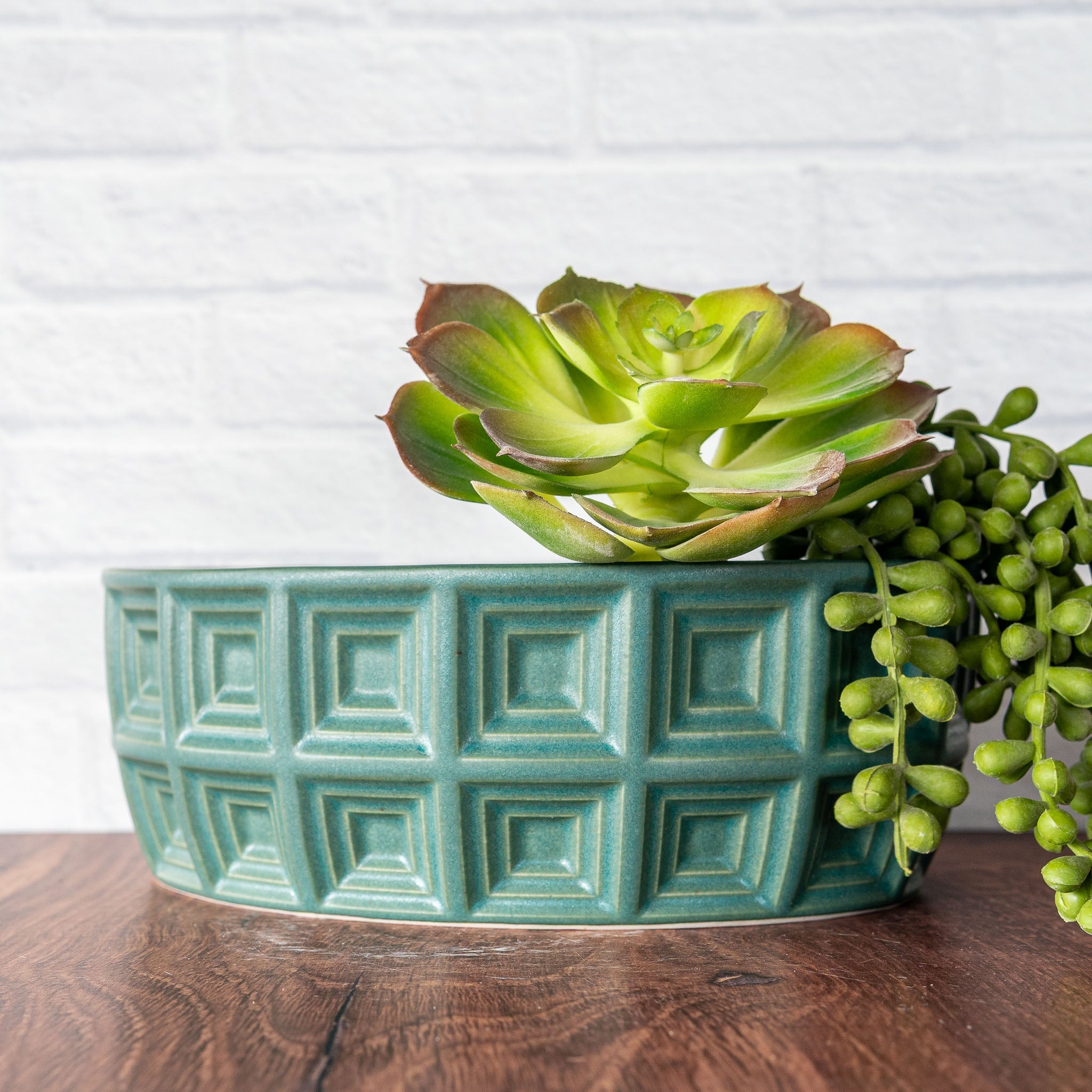 Hammerly Ceramics handmade slip-cast planter in smooth, matte jade green, oval with concentric recessed squares 