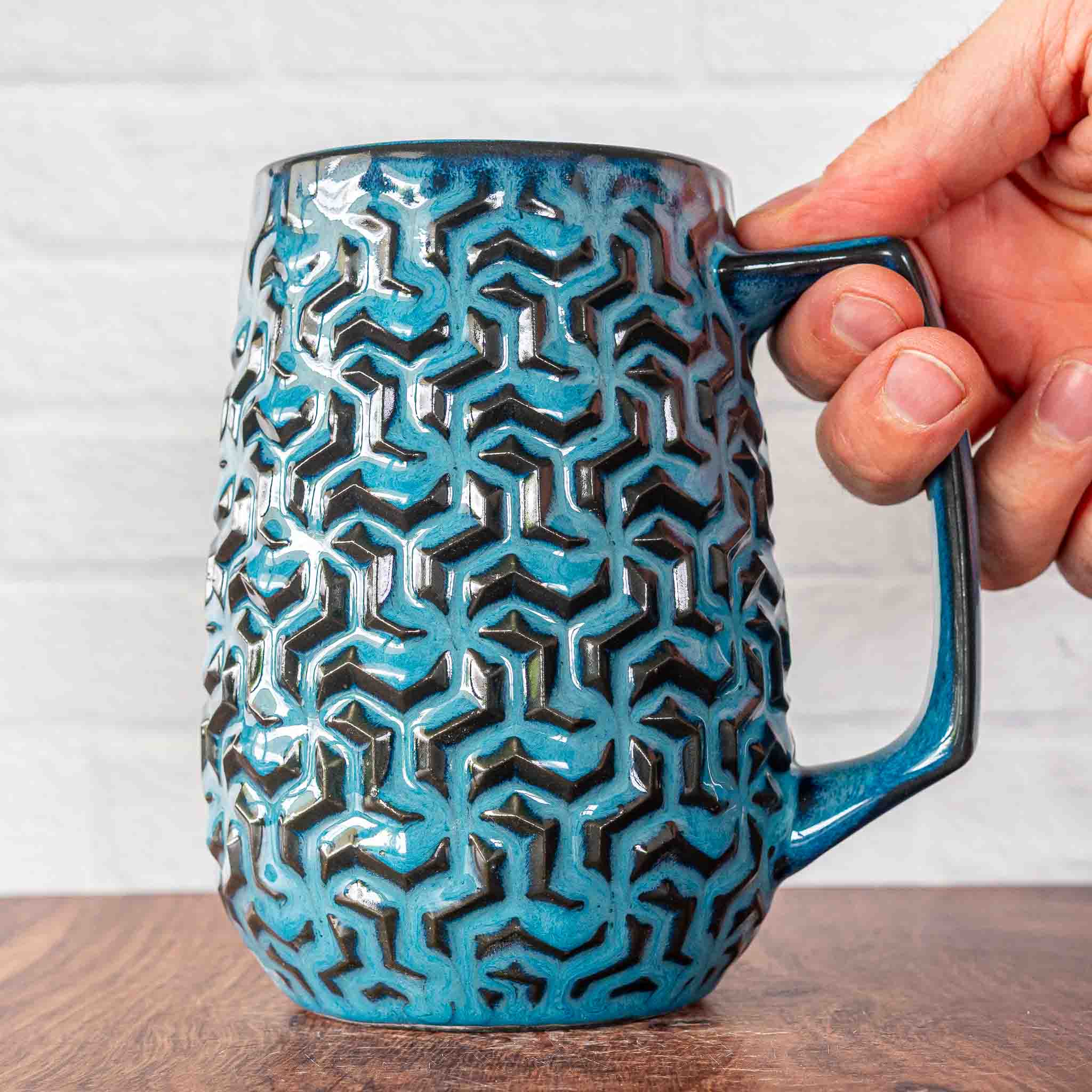 Hammerly Ceramics handmade decorative statue in ocean blue glaze with dark charcoal edges , interlocking geometric weave textured porcelain