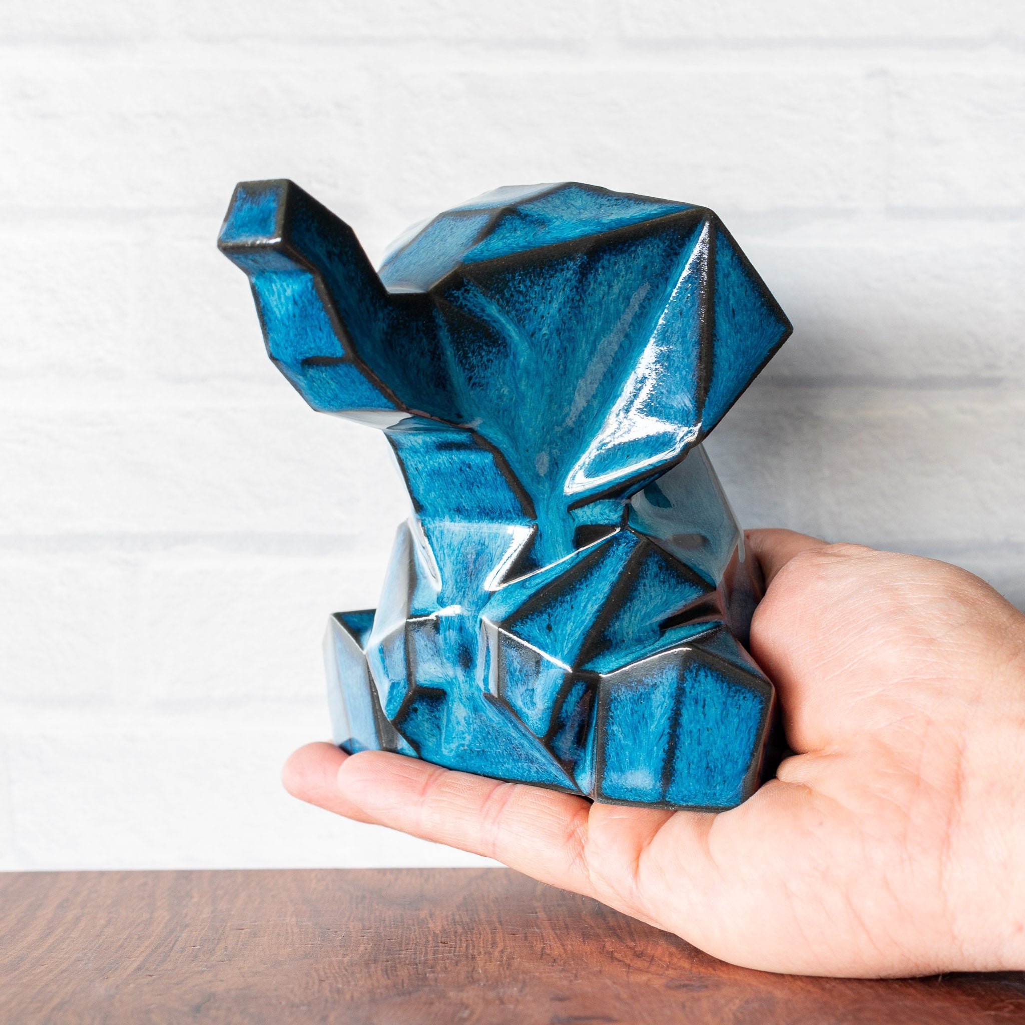 Hammerly Ceramics handmade decorative elephant statue in ocean blue glaze with dark charcoal edges, geometric elephant form