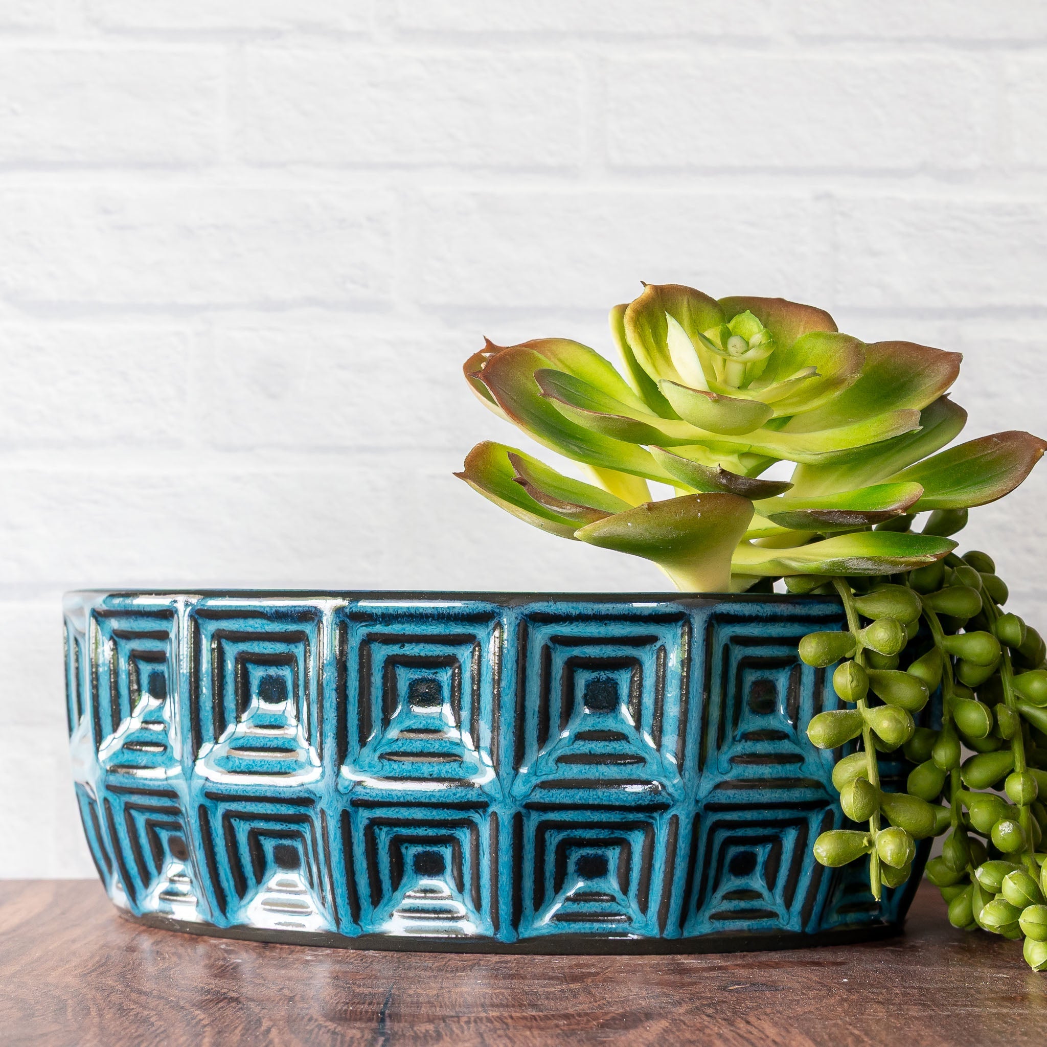 Hammerly Ceramics handmade slip-cast planter in ocean blue glaze with dark charcoal edges, oval with concentric recessed squares 
