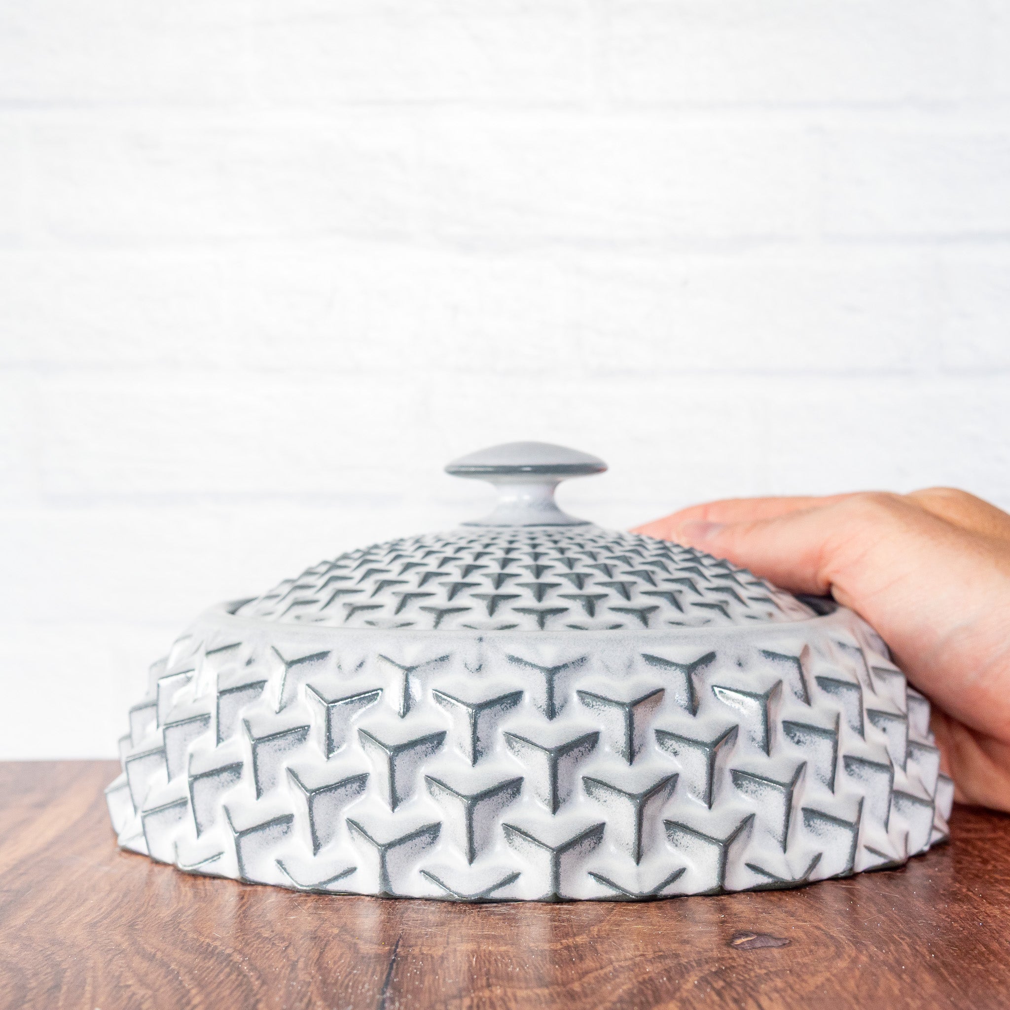 Hammerly Ceramics handmade slip-cast lidded jar in bright white over charcoal edges, geometric cubes textured porcelain